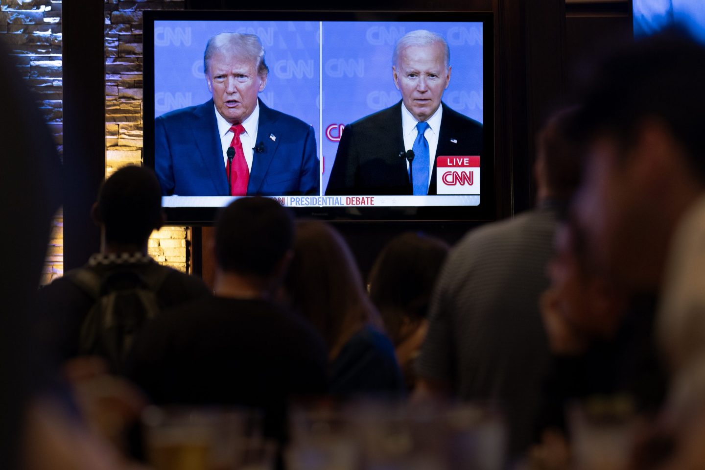 CHICAGO, ILLINOIS - JUNE 27: Guests at the Old Town Pour House watch a debate between President Joe Biden and presumptive Republican nominee former President Donald Trump on June 27, 2024 in Chicago, Illinois. The debate is the first of two scheduled between the two candidates before the November election. (Photo by Scott Olson/Getty Images)